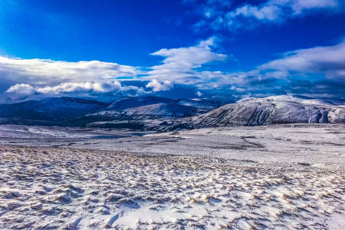 Snow and light across Wild Boar Fell
