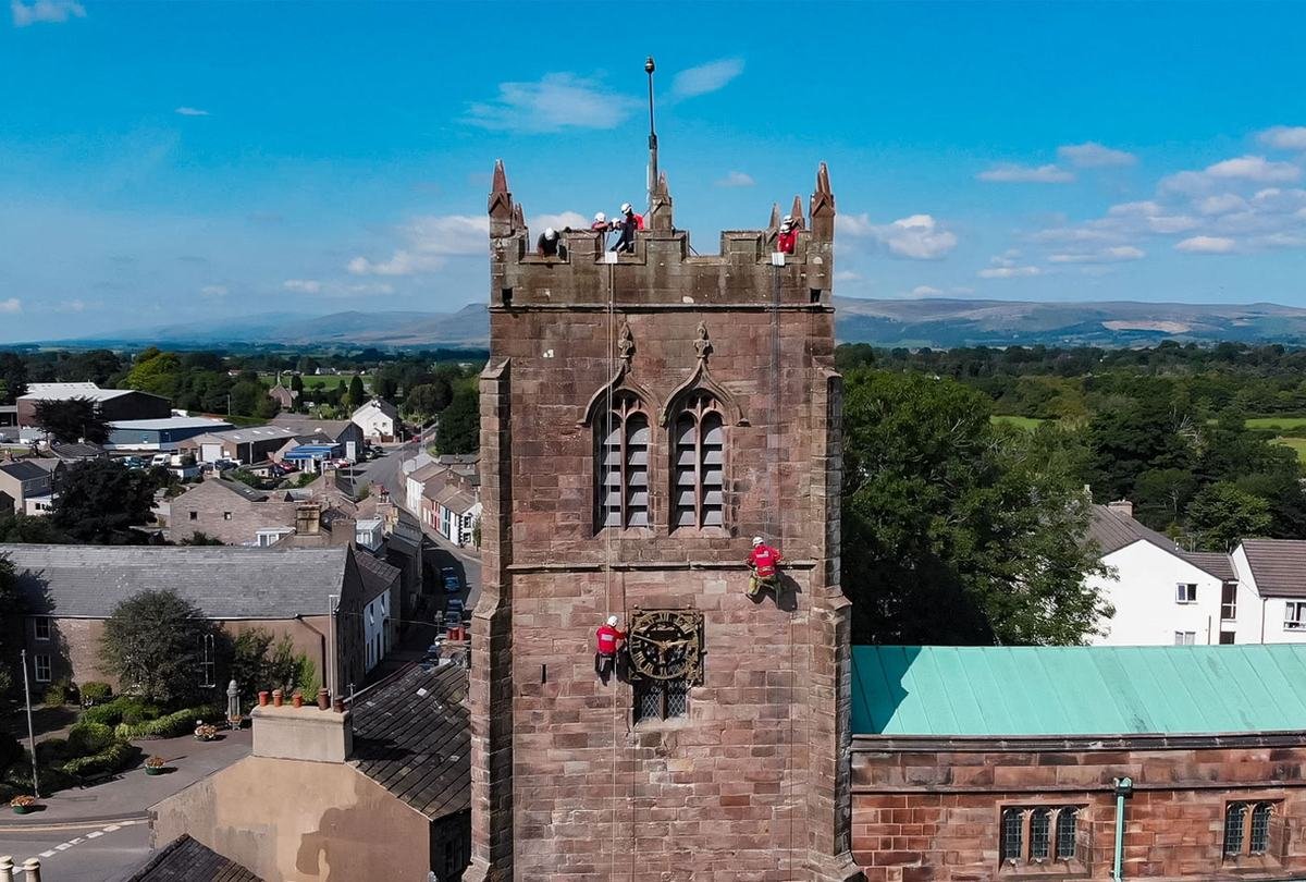 Kirkby Stephen Mountain Rescue team members on ropes at a church tower